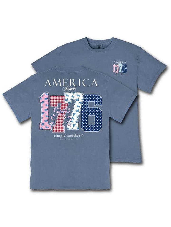 Mineral wash overcast blue tee features the phrase 'America